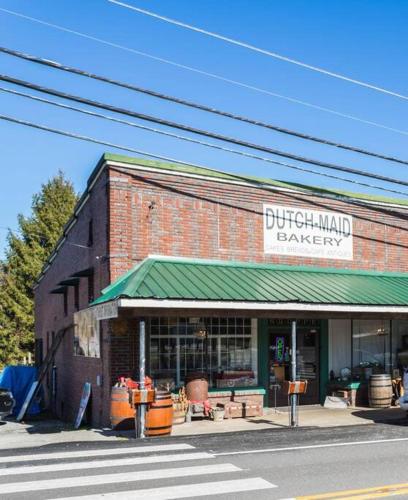 a brick building with a sign for a bakery at Worry B Gone in Tracy City