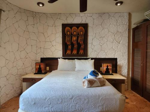 a bedroom with a large white bed in a room at Luxury Villa steps to the beach & 5ta av, AMAZING in Playa del Carmen