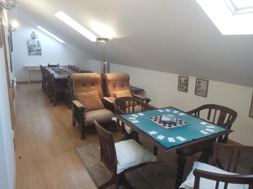 a dining room with a table and chairs at Solar Quinta de São Carlos in Viseu