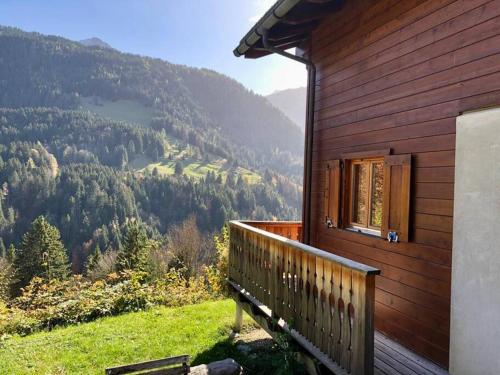 a balcony of a house with a view of a mountain at Chalet Villars-Gryon 8pax Cosy in Gryon