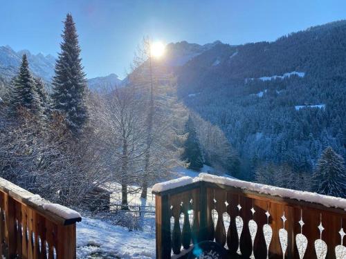 a balcony with a view of a snow covered mountain at Chalet Villars-Gryon 8pax Cosy in Gryon
