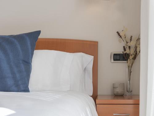 Voodi või voodid majutusasutuse Hostal ALBA Lugo toas