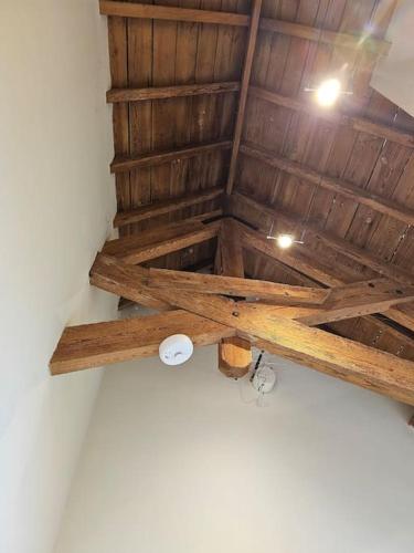 a ceiling in a room with a wooden ceiling at Hound Tor Barn Dartmoor in Manaton