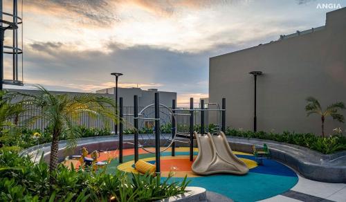 a childrens playground with a slide and a play park at The Song Premium Apartment in Vung Tau