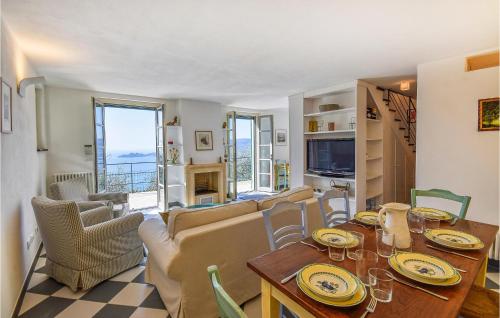 a dining room and living room with a table and chairs at Stunning Home In Zoagli With Wifi in Zoagli