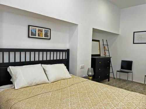 A bed or beds in a room at Apartamento Intramuros - Ole Solutions