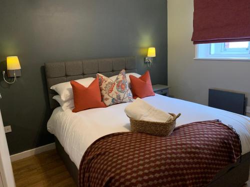 a bedroom with a bed with pillows on it at High Street Town House in Manchester