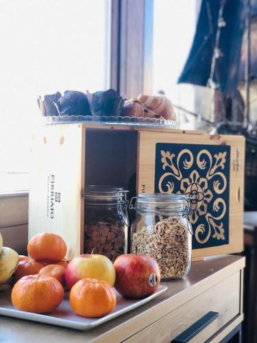 a table with a box and a plate of food at Santa Lucia in Capo dʼOrlando