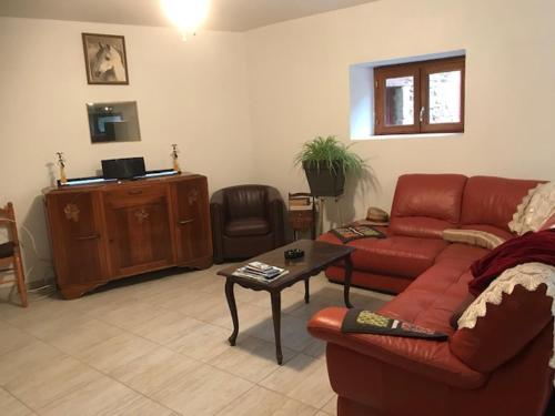 Zona de estar de L'Escapade de JOS , chambres et table d'hôte