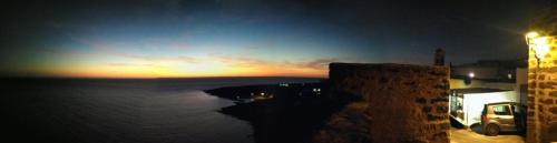 a sunset over a body of water at night at Belvedere in Pantelleria
