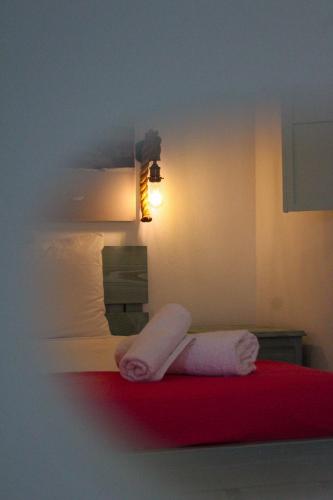 a hotel room with two towels on a bed at Mistral-Patmos in Patmos