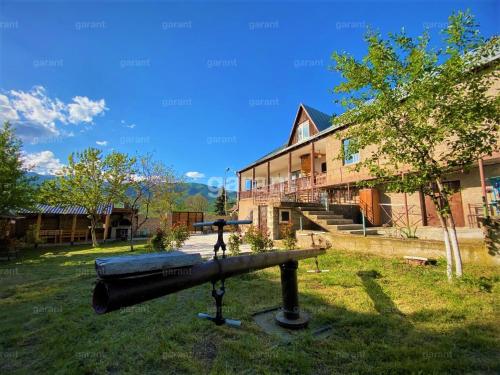 a bbq grill in front of a house at BIG HOUSE in Dilijan