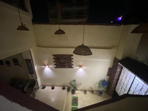 an overhead view of a living room with lights at Pyramids Lounge Guest House in Cairo