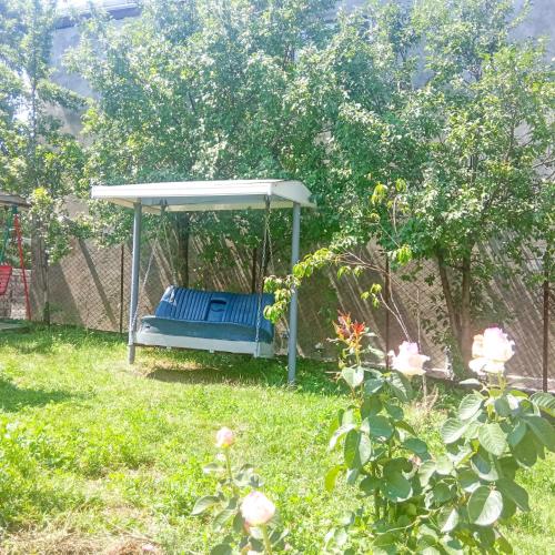 a swing in a yard with a white canopy at BIG HOUSE in Dilijan