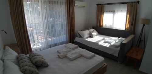 Кровать или кровати в номере Lindos Pension