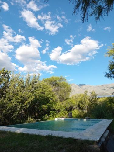 a swimming pool with a view of the mountains at Hexágono de San Javier in San Javier