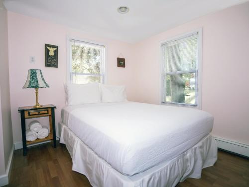 Ένα ή περισσότερα κρεβάτια σε δωμάτιο στο Hamptons Vacation Inn