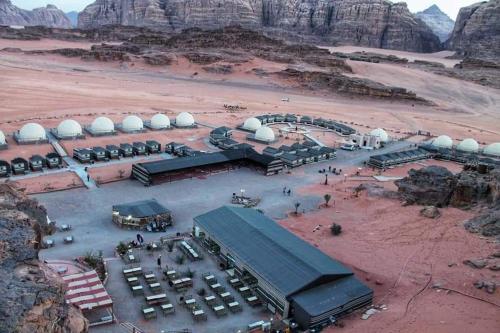 an aerial view of a building in the desert at Tareqzwy wadi rum in Wadi Rum