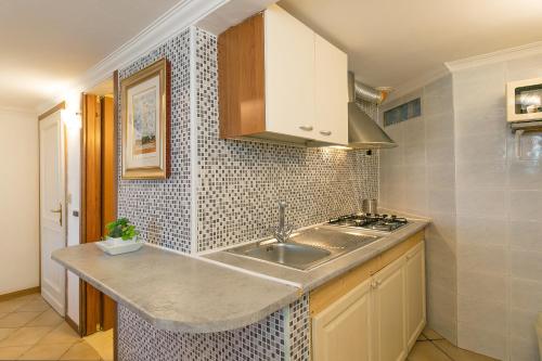 Η κουζίνα ή μικρή κουζίνα στο Residenza Solferino Castiglioncello