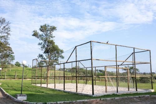 a batting cage in a park at Class Hotel Passos Rio Grande Portal da Canastra in Passos