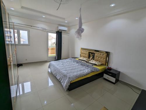 Postel nebo postele na pokoji v ubytování MBAO Sipres Appartement moderne bord de mer