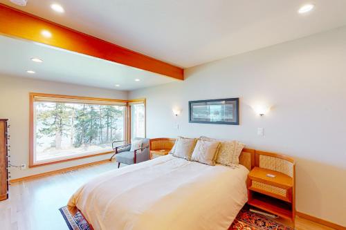 Un pat sau paturi într-o cameră la Gleeson's Bay House