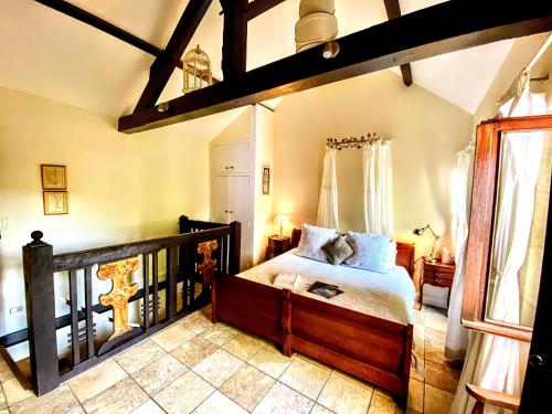 a bedroom with a large bed in a room at La Lanterne Chambres d'Hotes in Sarlat-la-Canéda