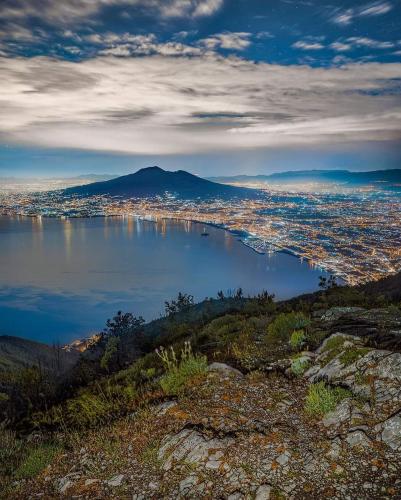 a view of a city and a body of water at Vient' e mar suite in Castellammare di Stabia