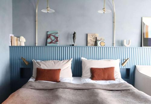 a bedroom with a bed with two pillows at Best Western Plus John Bauer Hotel in Jönköping