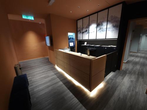 an office with a reception desk in a room at Yu Hotel Chinatown in Kuala Lumpur