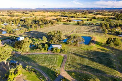 an aerial view of a farm with fields and trees at Midnight's Promise - Promise 1 in Lovedale