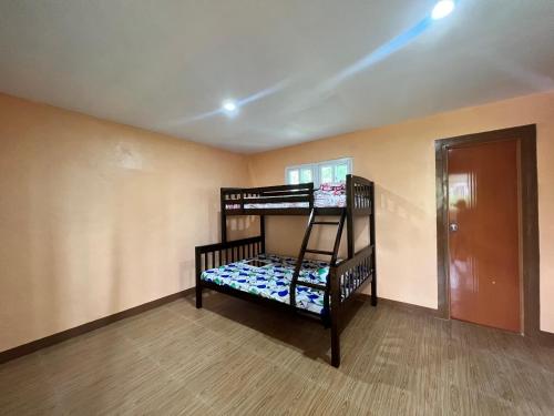 a room with two bunk beds in a room at Elena Guest House & Resort in Medellin