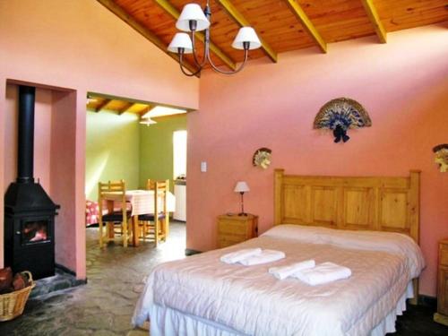 Кровать или кровати в номере Cabañas Posada Del Tigre