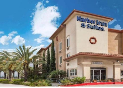 ariott inn and suites sign on the side of a building at Harbor Inn & Suites in Anaheim