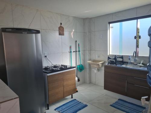 Kuchyň nebo kuchyňský kout v ubytování MACOCA TAMANDARÉ FLAT