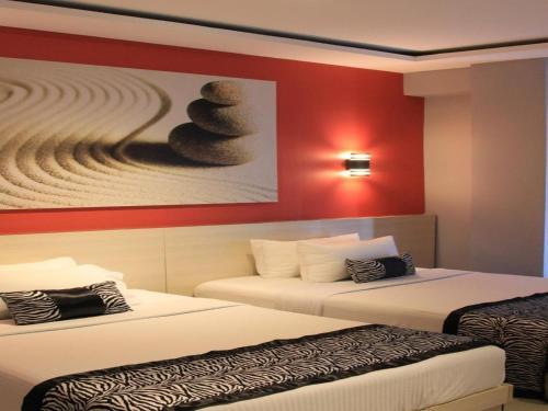 Krevet ili kreveti u jedinici u okviru objekta Sumo Asia Hotels - Davao