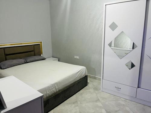 En eller flere senge i et værelse på Apartment Asilah