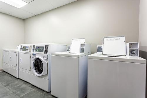 a laundry room with washing machines and a washer and dryer at TownePlace Suites by Marriott Raleigh - University Area in Raleigh
