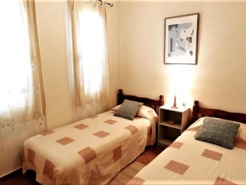 A bed or beds in a room at House in paradisiacal beach area La Isleta, Níjar