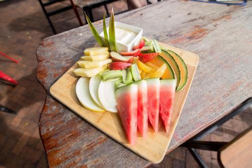 a cutting board topped with sliced up vegetables at Base Airlie Beach in Airlie Beach