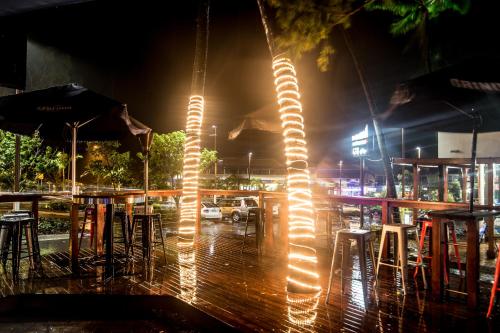 a string of lights hanging from a pole at night at Base Airlie Beach in Airlie Beach