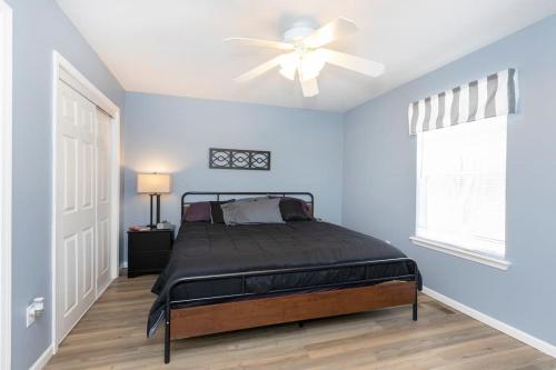 a bedroom with a bed and a ceiling fan at *4BR 2BA N Shore Hidden Retreat* in Roscommon