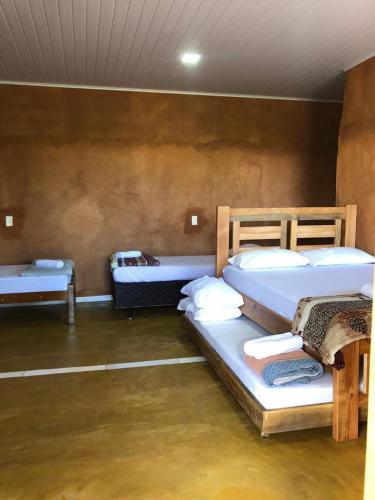 Un pat sau paturi într-o cameră la Recanto do Vale