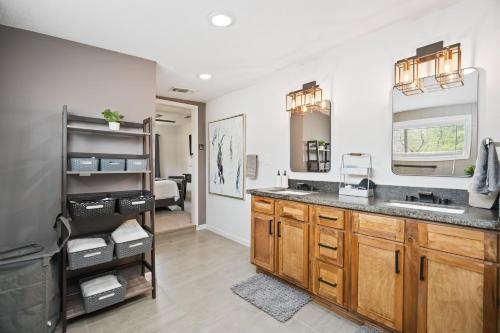 a kitchen with a sink and a counter top at The Gated Modern Home Near NRG and Medical Center in Houston