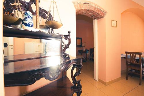 a dining room with a table with vases on it at Relax Brugnato in Brugnato