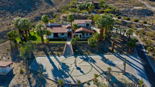 an aerial view of a house with a basketball court at Big Horn Desert Estate Luxury Smarthome - Amazing Pool & Game Room! in Palm Desert