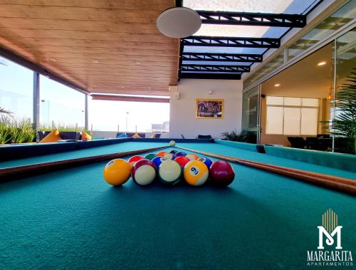 a pool table with balls on top of it at Margarita Apartamentos in Cochabamba