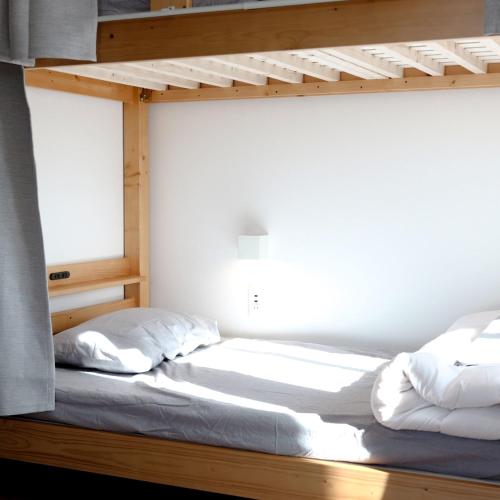 Matoi Hostel & Barにあるベッド