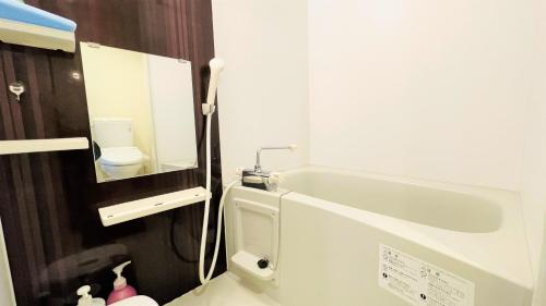 a small bathroom with a sink and a toilet at Credo Maison Kamakura 101 in Kamakura