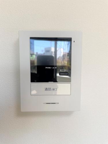 a white tv on a wall in a room at Credo Maison Kamakura 101 in Kamakura